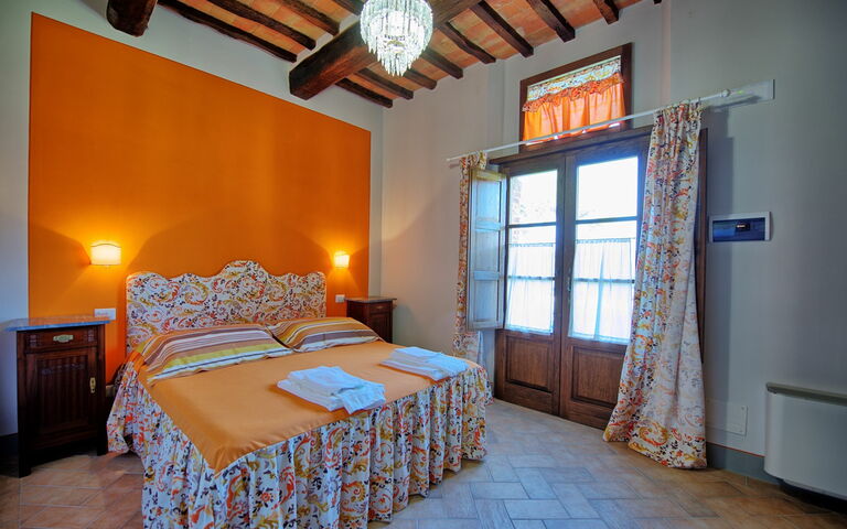 Logement Granaio Apartment: chambre à coucher