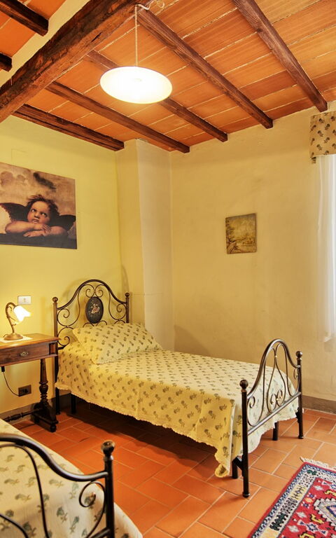 Villa Capolona: chambre à coucher