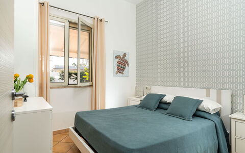 Logement Kalika: chambre à coucher