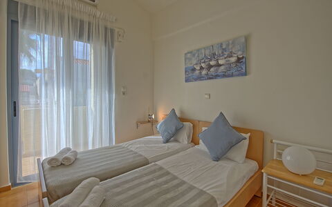 Logement Emmanouela: chambre à coucher