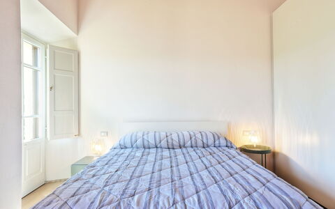 Logement La Pergola: chambre à coucher