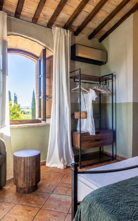 Podere Peteglia: chambre à coucher