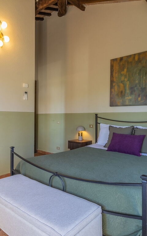 Podere Peteglia: chambre à coucher
