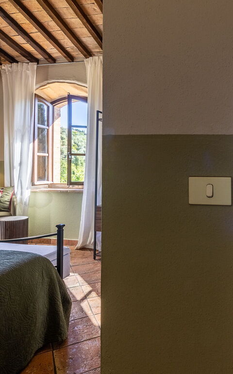 Podere Peteglia: chambre à coucher