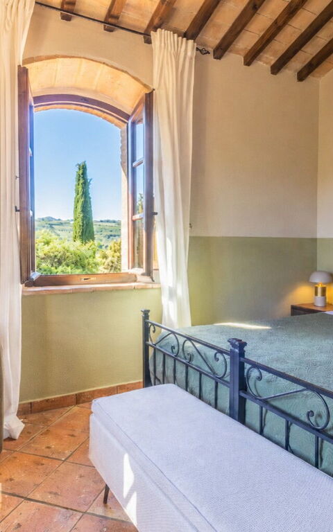 Podere Peteglia: chambre à coucher