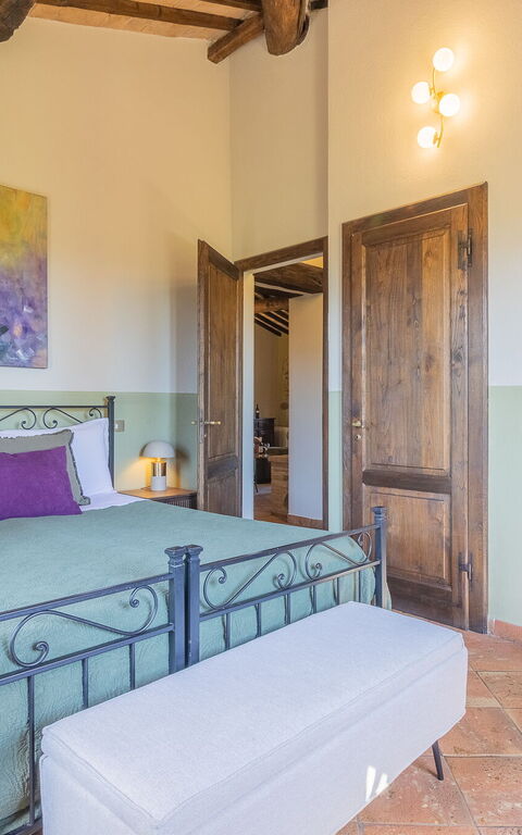 Podere Peteglia: chambre à coucher