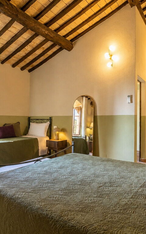 Podere Peteglia: chambre à coucher