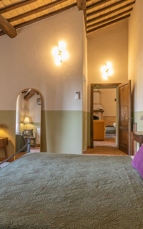 Podere Peteglia: chambre à coucher