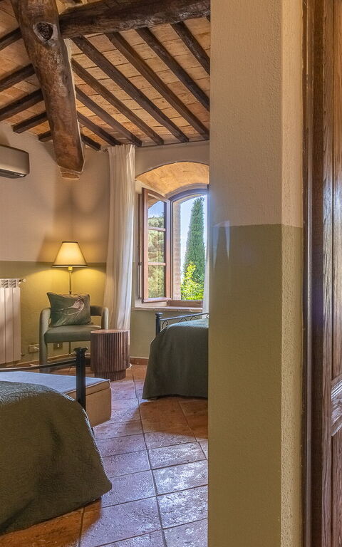 Podere Peteglia: chambre à coucher