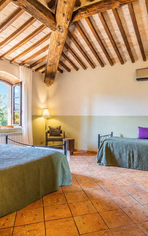 Podere Peteglia: chambre à coucher