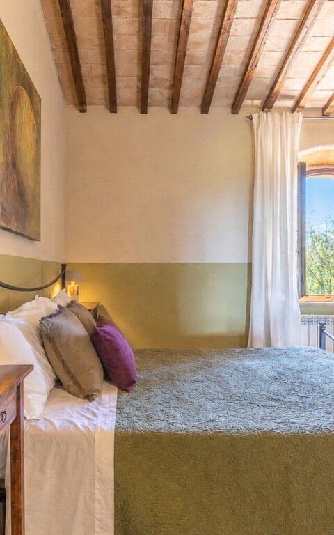 Podere Peteglia: chambre à coucher