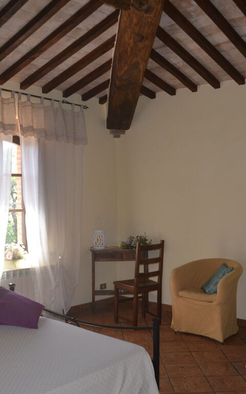 Podere Peteglia: chambre à coucher
