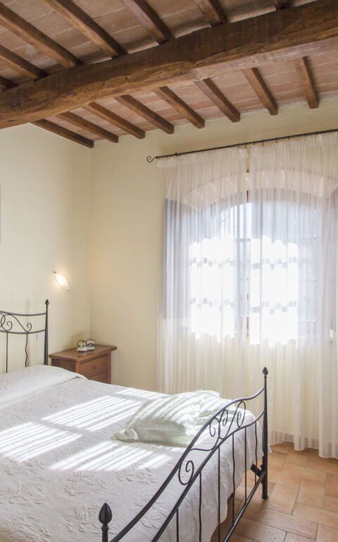 Podere Peteglia: chambre à coucher