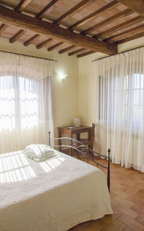 Podere Peteglia: chambre à coucher