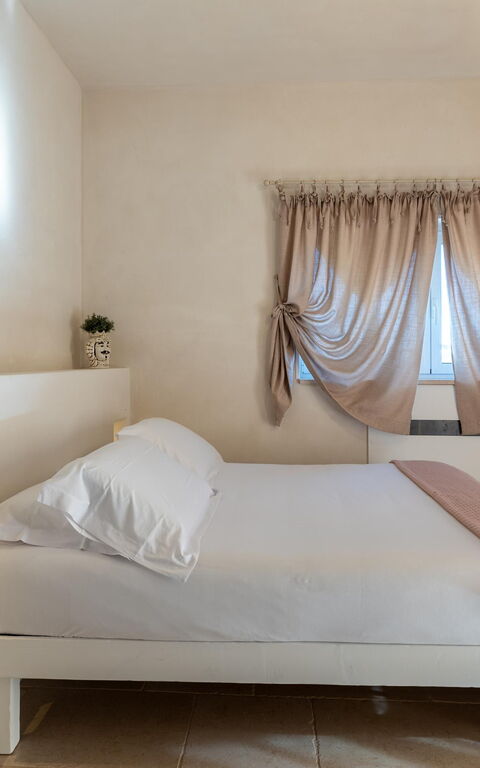 Villa Calanthia: chambre à coucher